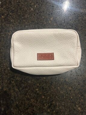 Dooney & Bourke Cream Pebbled Leather Cosmetic Pouch with Red Lining